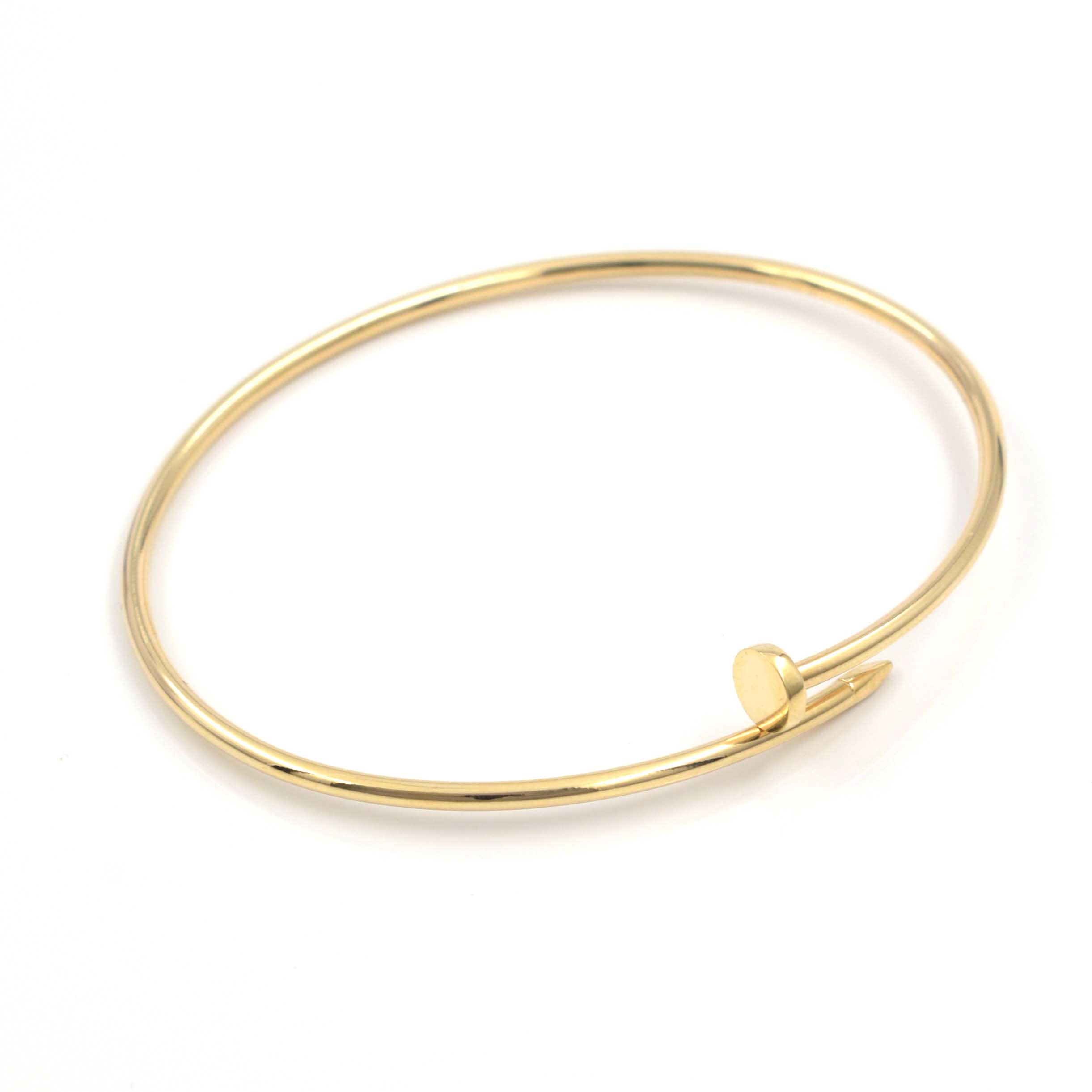 Дамска твърда гривна Golden Nail на бял фон